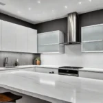A modern kitchen bathed in warm white LED recessed lighting highlighting sleekfeat