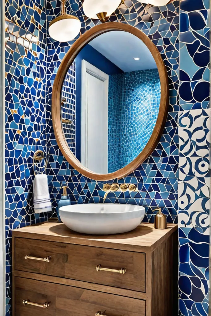 Blue vanity and mosaic tile walls add a pop of color to a budgetfriendly bathroom