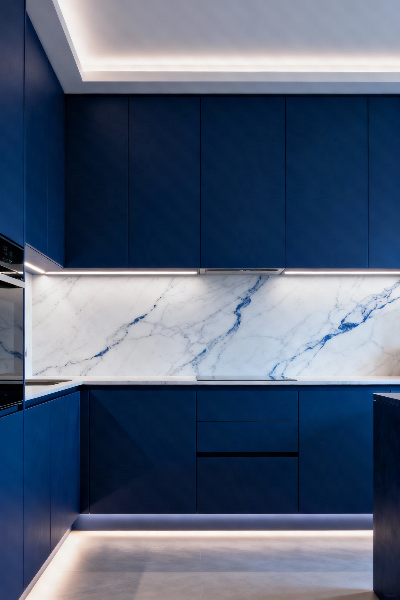 Modern blue kitchen with integrated under-cabinet, toe-kick, and cove LED lighting, showcasing enhanced depth and rich blue tones on cabinetry and stone surfaces.