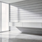 A modern minimalistic bathroom showcasing a sharp floating vanity and linear wall tiles with precise geometric alignment.